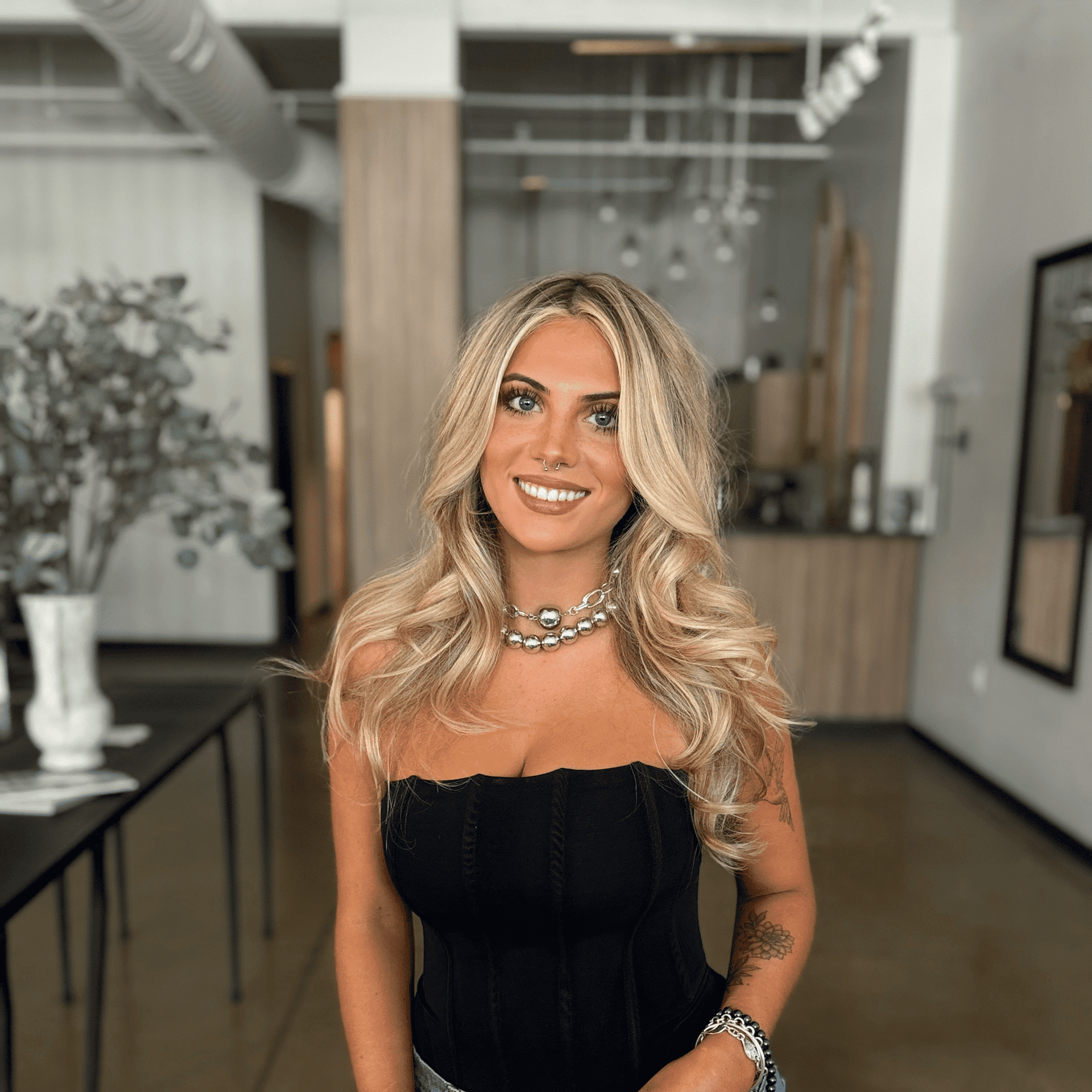 Portrait of Heidi Swain, a professional stylist at Atelier, showcasing their expertise and style.
