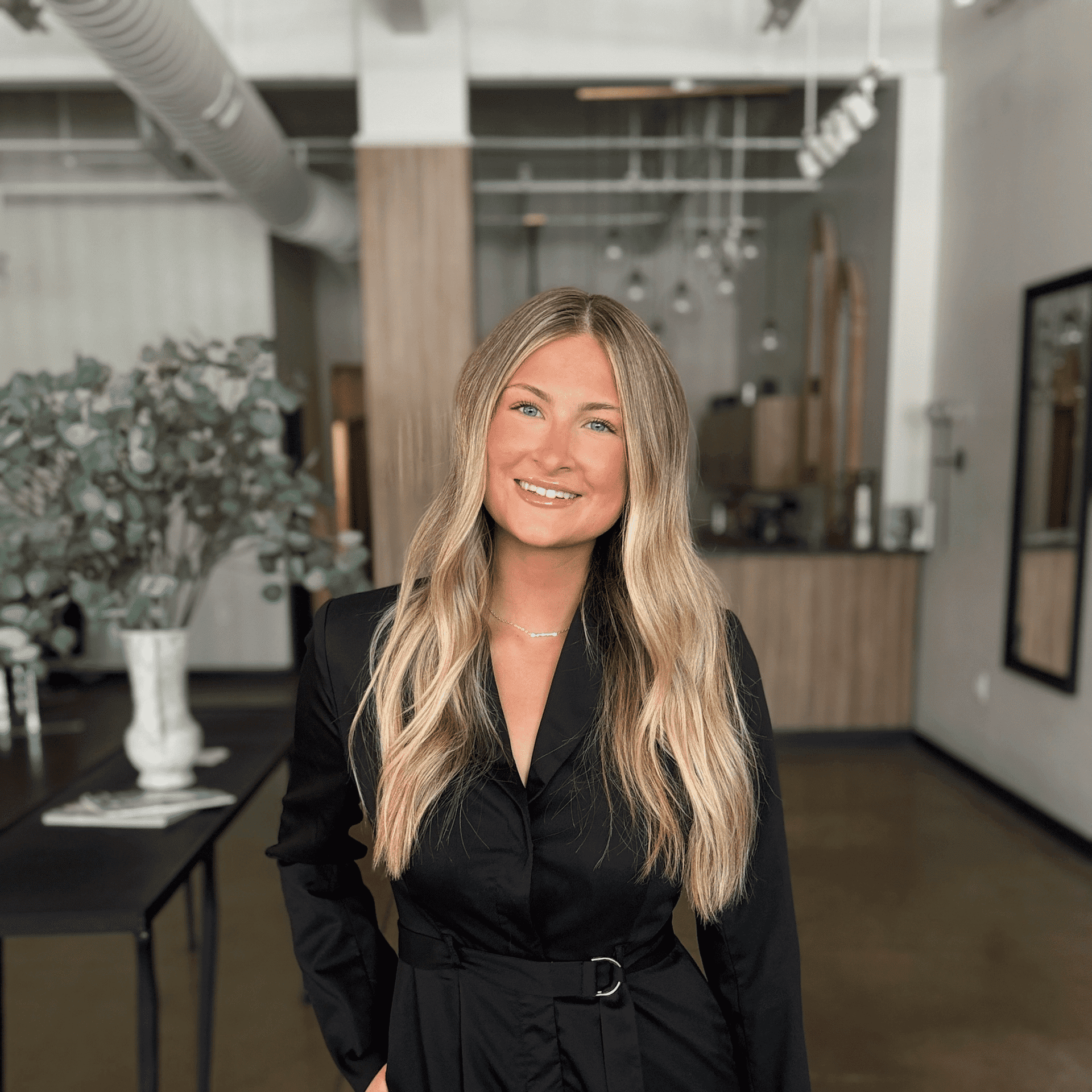 Portrait of Sami Baldigowski, a professional stylist at Atelier, showcasing their expertise and style.