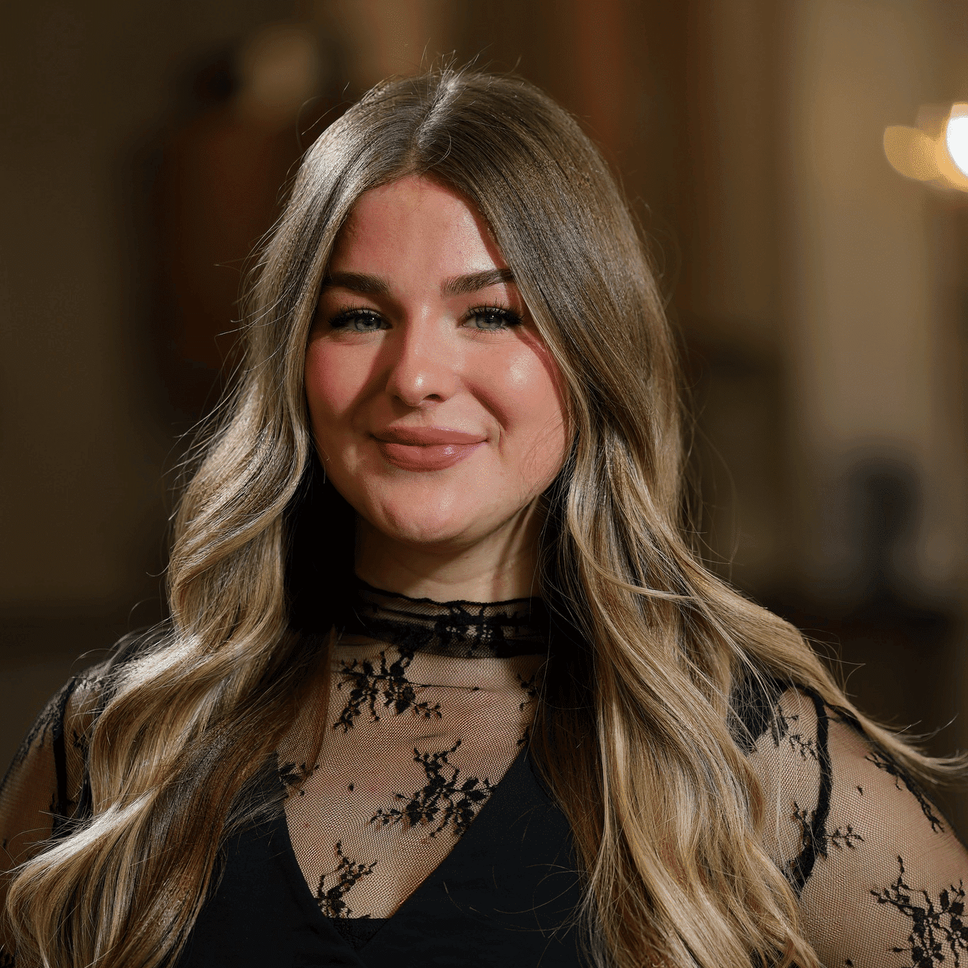 Portrait of Emily Anderson, a professional stylist at Atelier, showcasing their expertise and style.