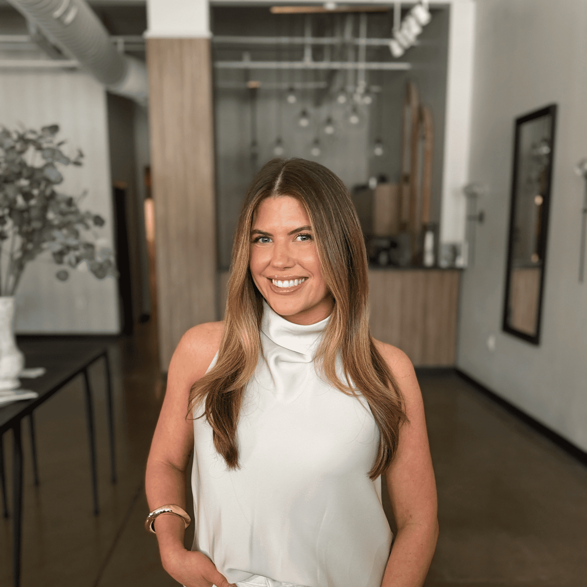 Portrait of Alicia Tresky, a professional stylist at Atelier, showcasing their expertise and style.