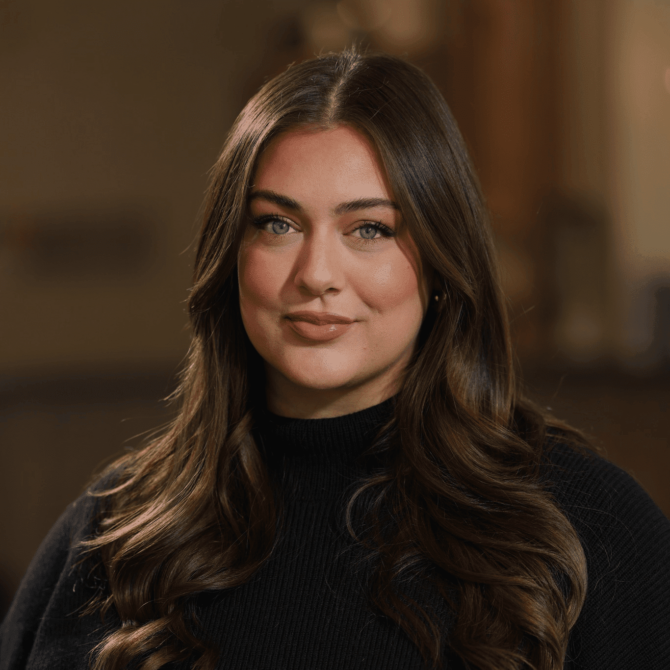 Portrait of Olivia Smart, a professional stylist at Atelier, showcasing their expertise and style.