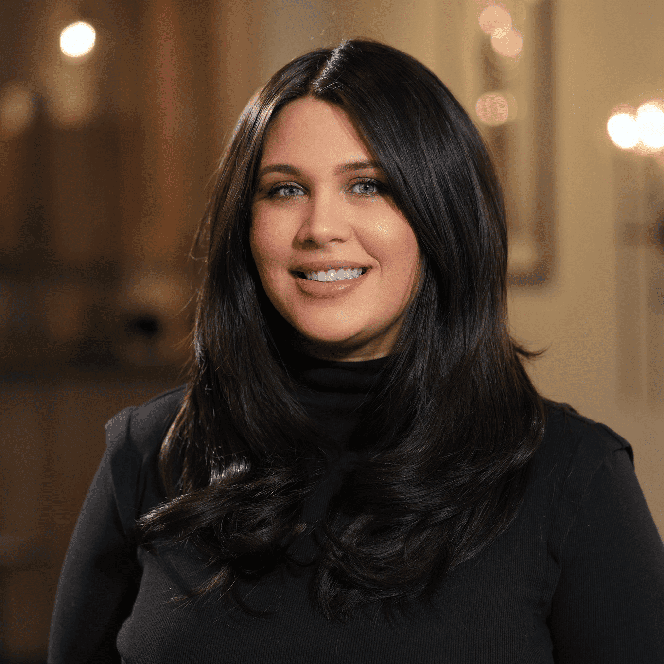 Portrait of Abigail Pattison, a professional stylist at Atelier, showcasing their expertise and style.