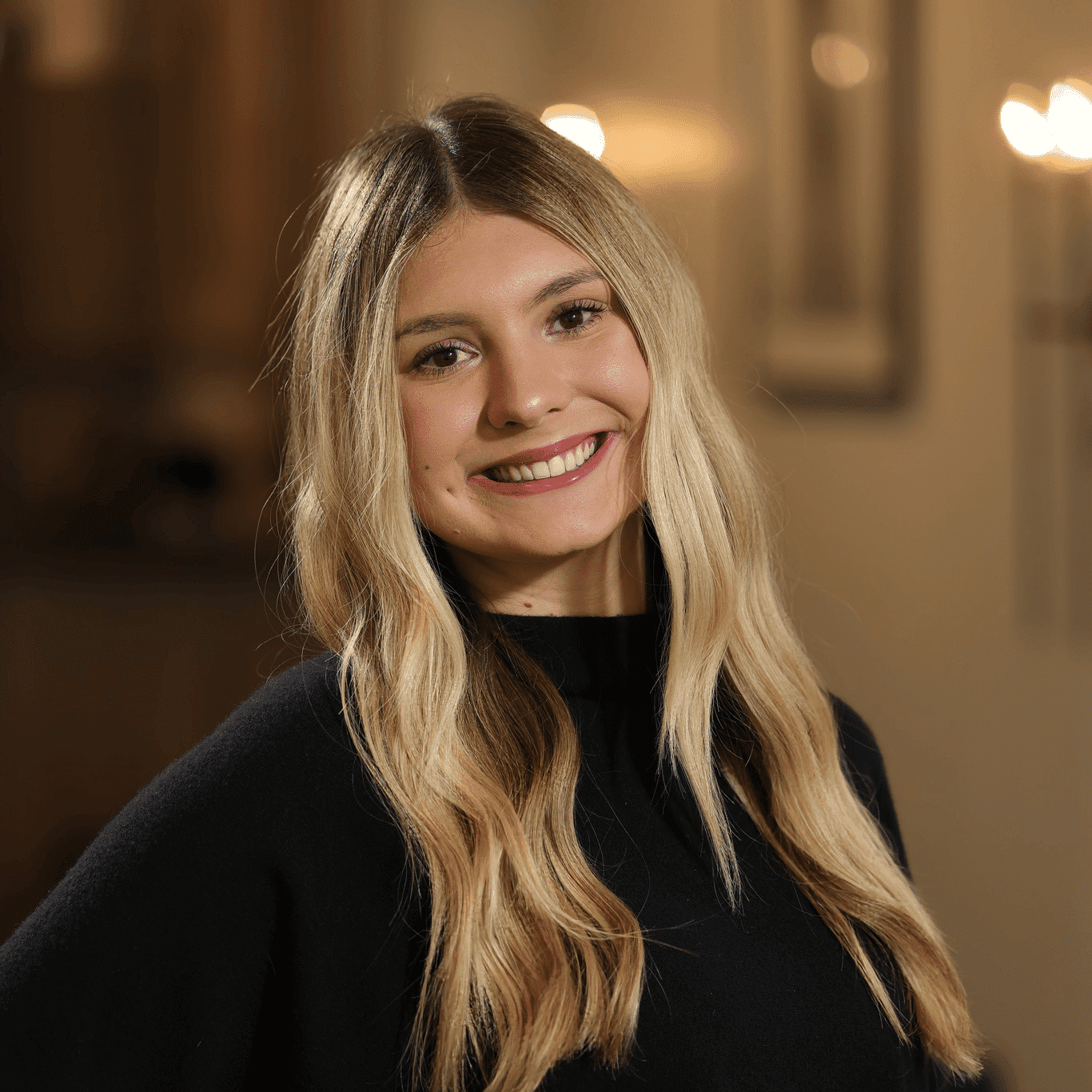 Portrait of Ava Galicic, a professional stylist at Atelier, showcasing their expertise and style.